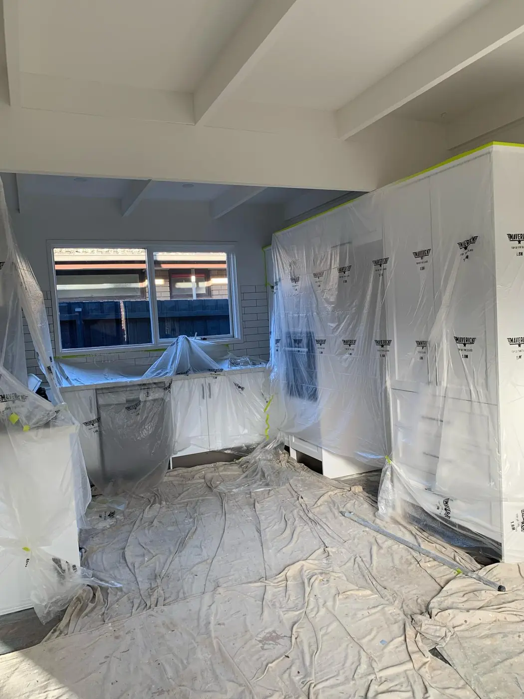 Protected kitchen prepared for interior painting